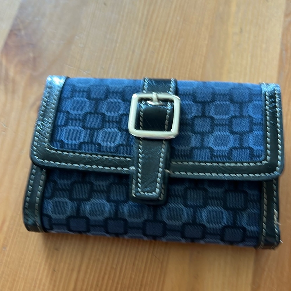 Excellent condition! Lots of card holders! 2 large pockets for bills etc